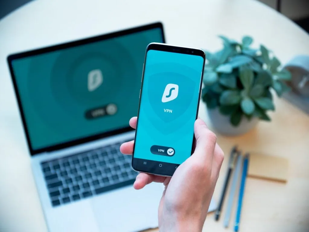 NordVPN vs ExpressVPN comparison on smartphone and laptop