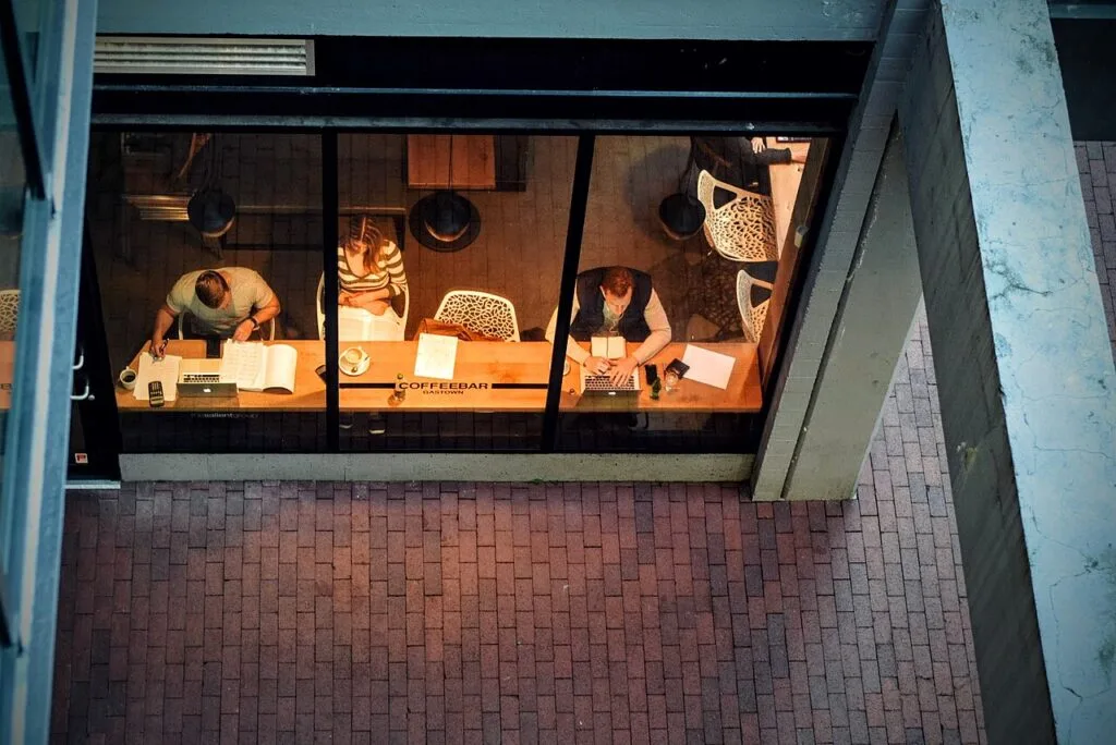 Is public Wi-Fi safe — people working on laptops in a coffee shop