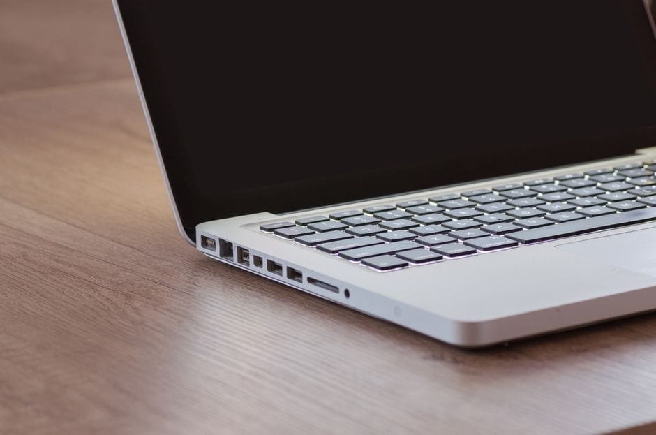 Close-up of a laptop's side ports, representing VPN and network setup